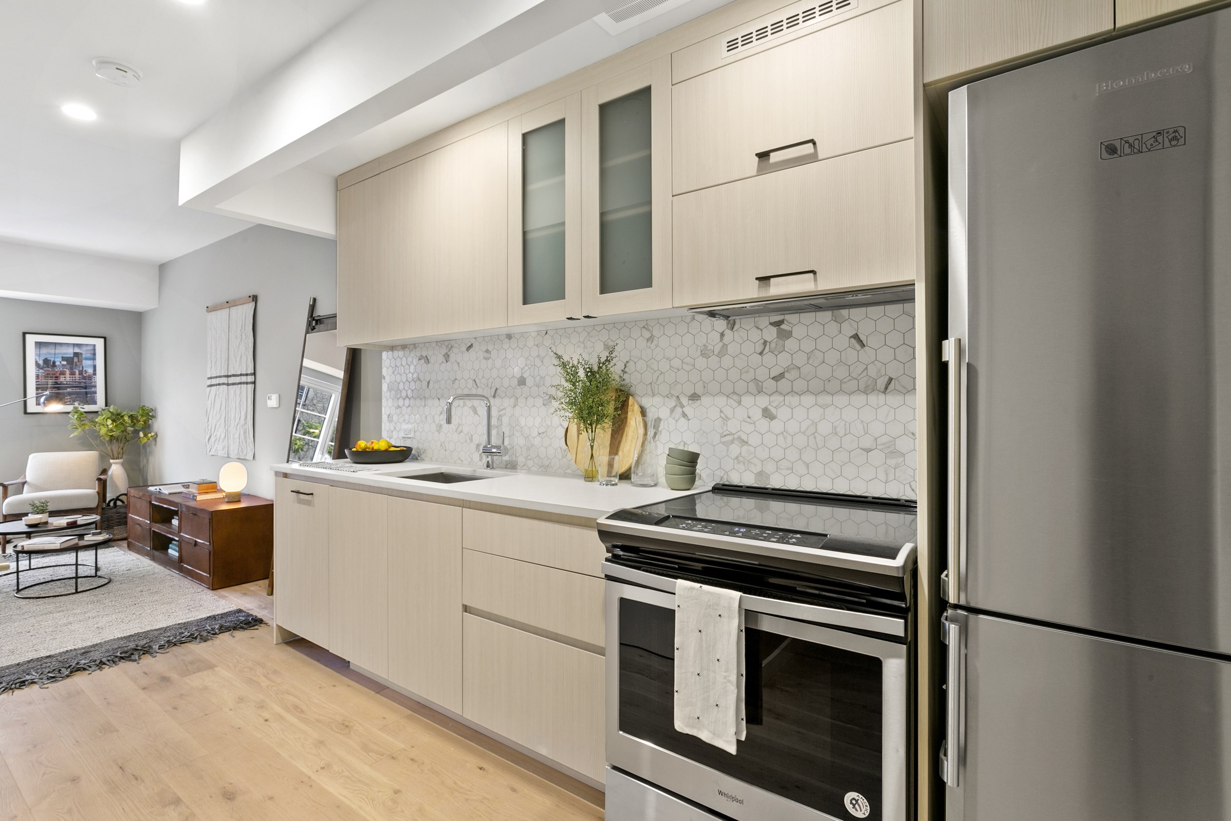 Kitchen and living space in a 555 Waverly studio unit