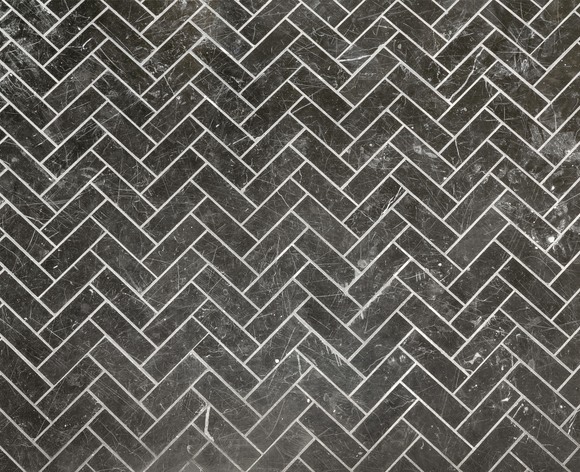 Herringbone style tiles on a 555 Waverly unit's floor