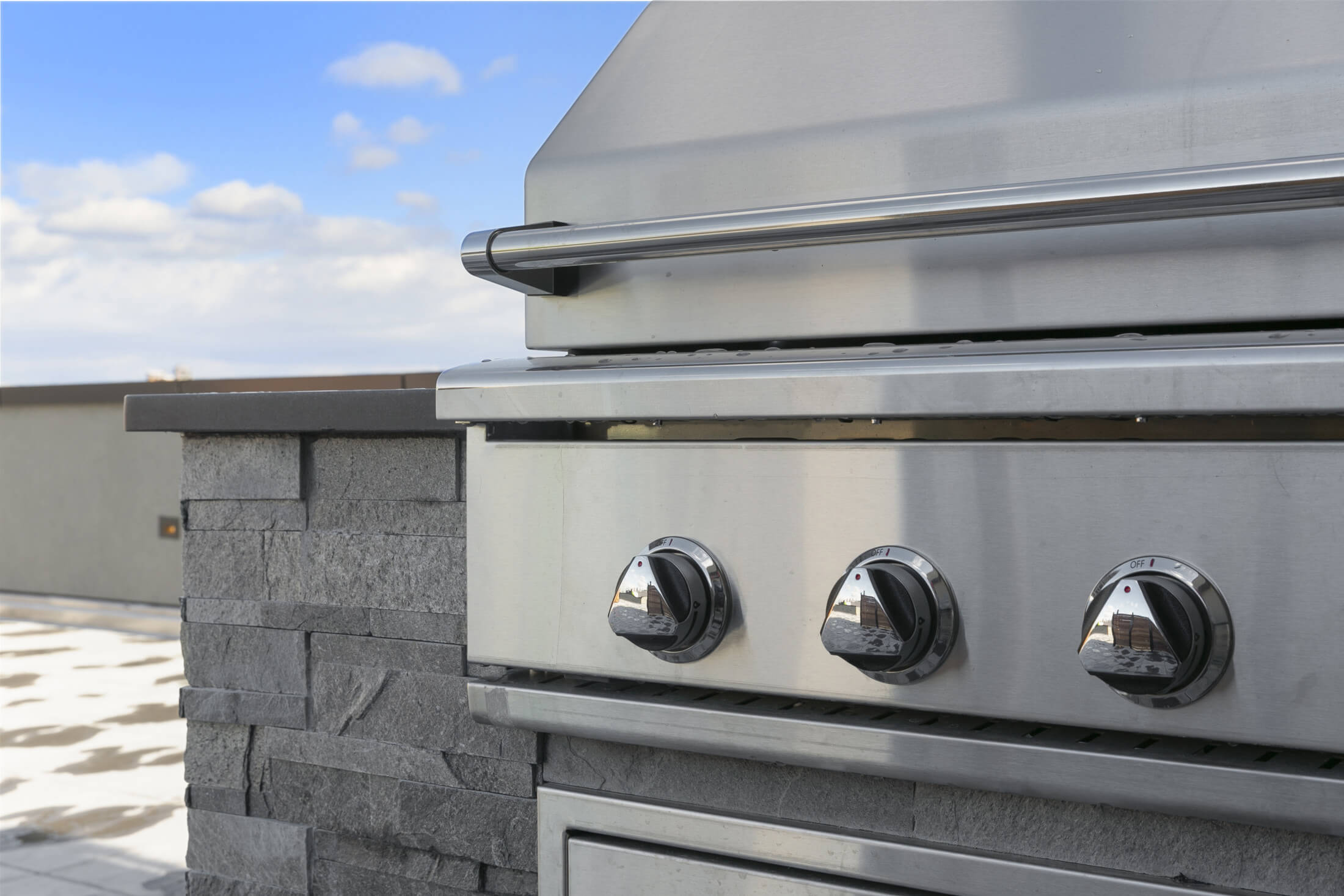 Close up of barbeque on 555 Waverly's roof deck